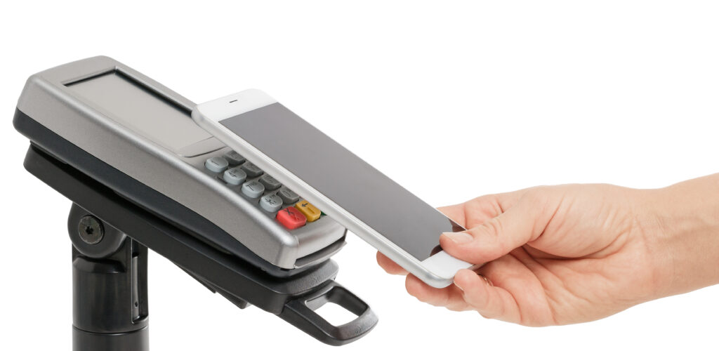 contactless payment with smartphone using payment terminal white background